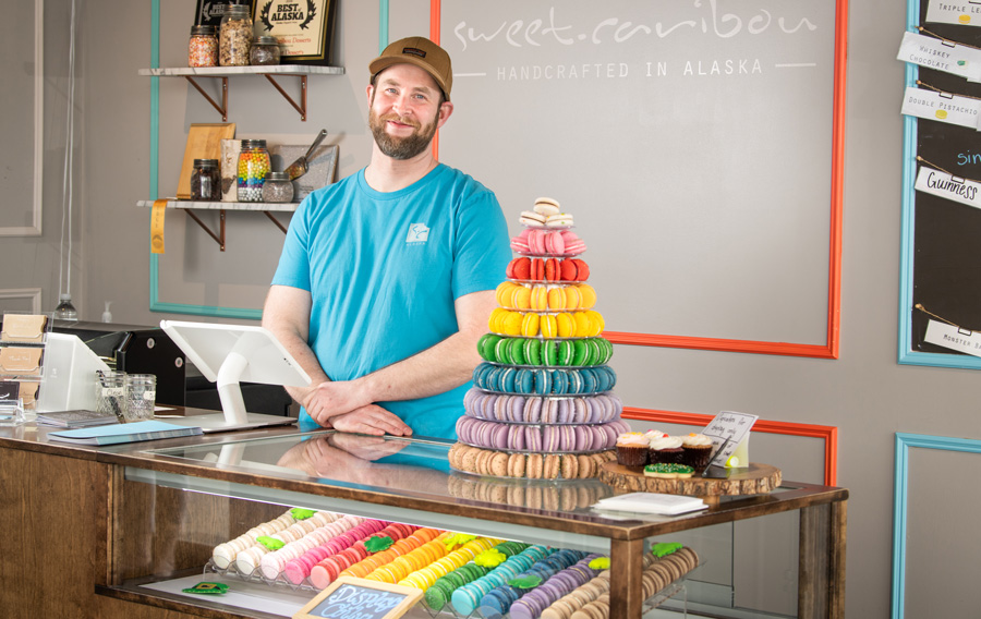 James Strong behind his store counter