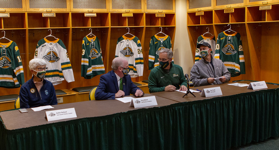 Save Seawolf Hockey founder Kathie Bethard, UAA Director of Athletics Greg Myford, UAA Chancellor Sean Parnell and Seawolf hockey alumnus Jim Mayes, B.Ed. ’94