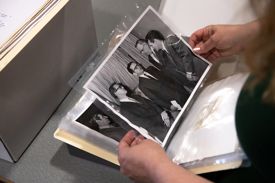 Arlene Schmuland, head of Archives and Special Collections and professor of library science, looks through photos from the recently donated Ted Stevens ANCSA sub-collection.