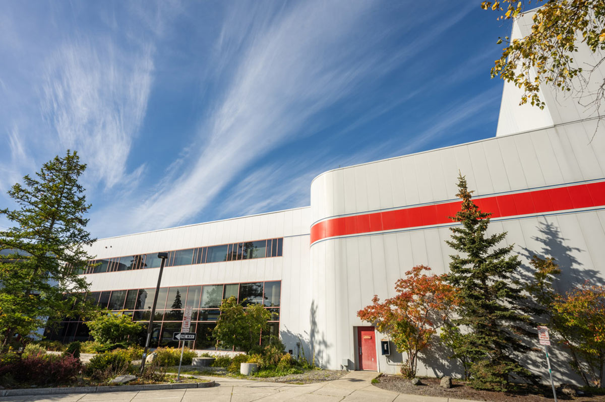 Landscape close-up photo outdoor angle view of the UAA's Fine Arts Building on a fall afternoon